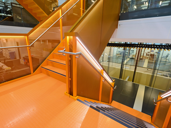 Bright orange staircase in an office building